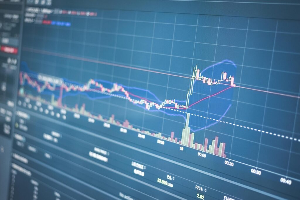 Close-up of a financial graph on a screen showing stock market trading data and trends.